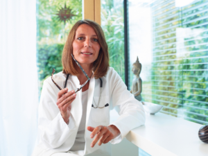 Doctor sitting at desk in office