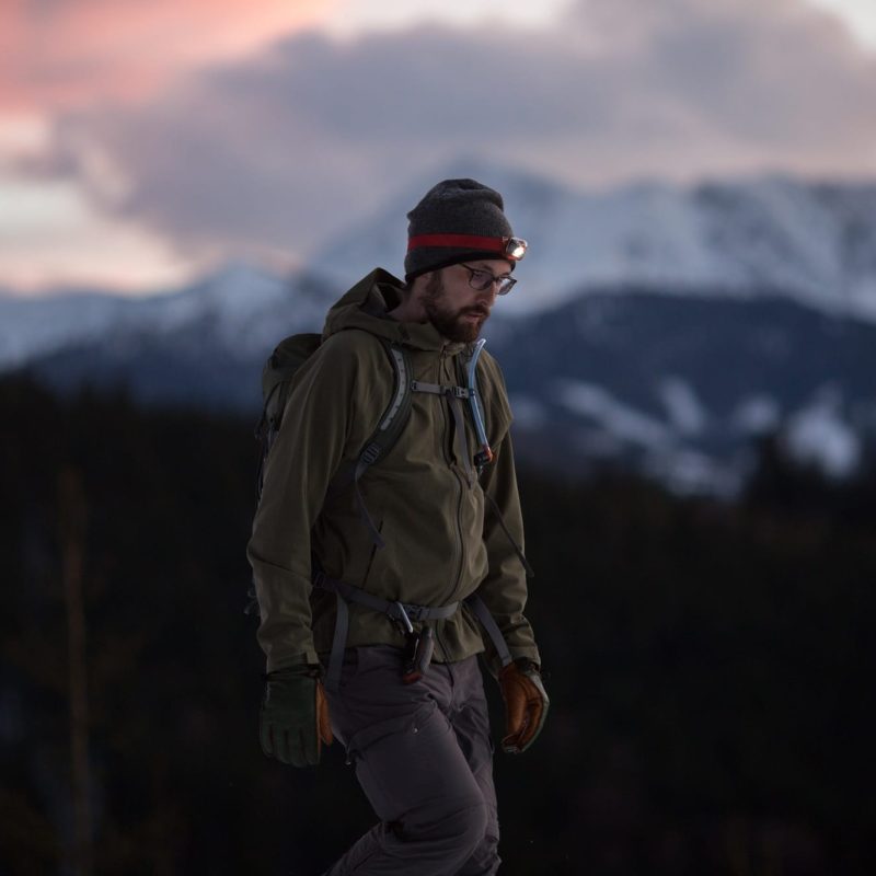 The hiker in winter at sunset